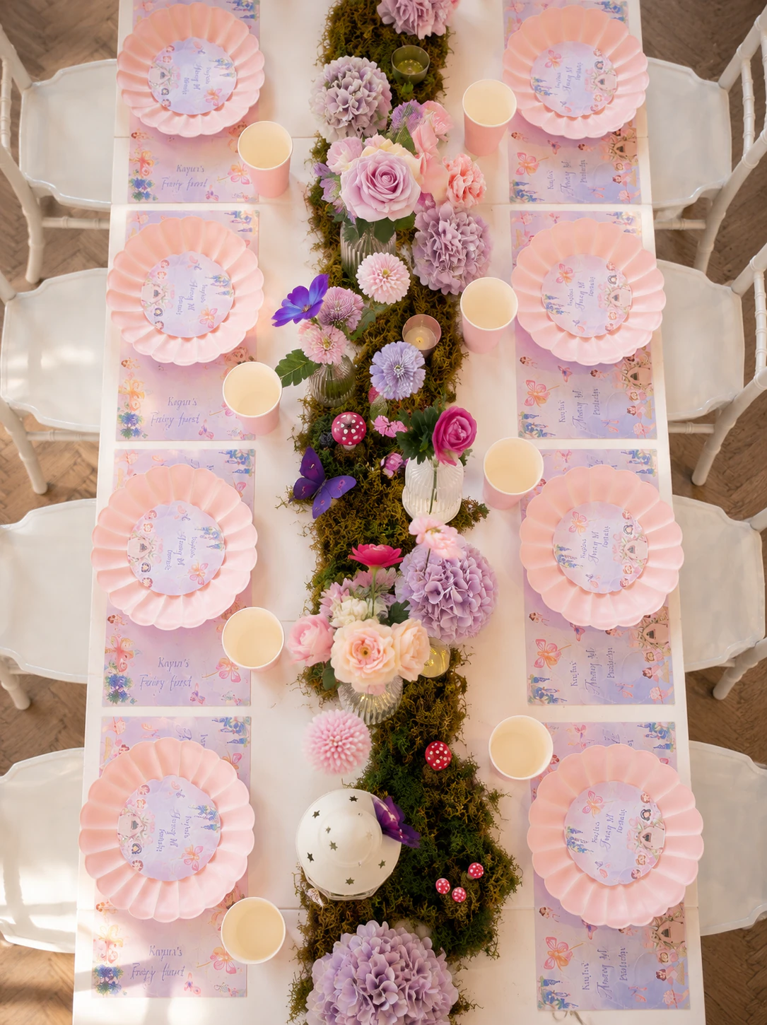 Fairy first birthday tablescape overhead for Kayla in Surrey by River Fox Events - pastel place settings, mossy runner and trailing florals