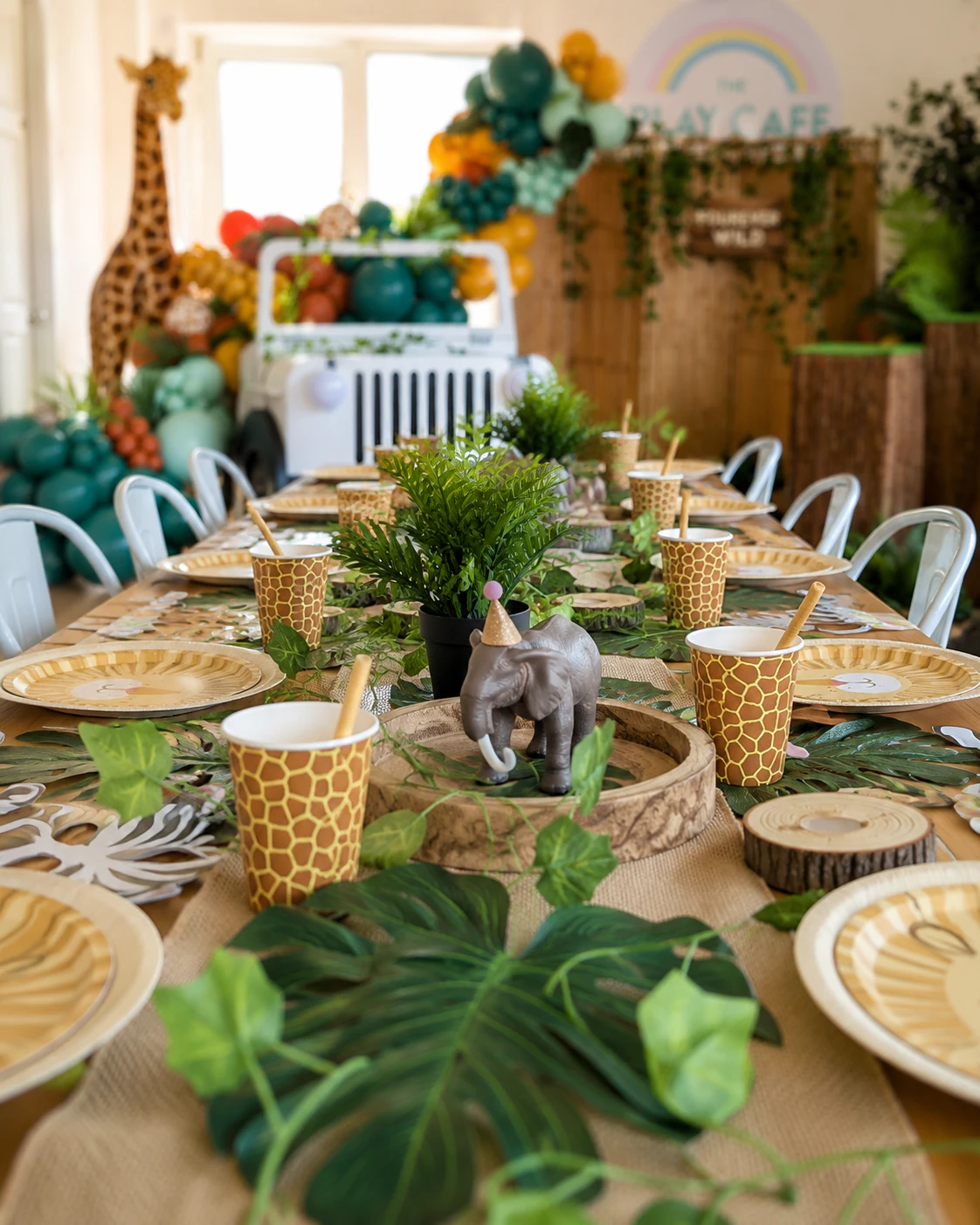 Jungle theme tablescape by River Fox Events - elephant centrepiece with monstera runner and safari balloons