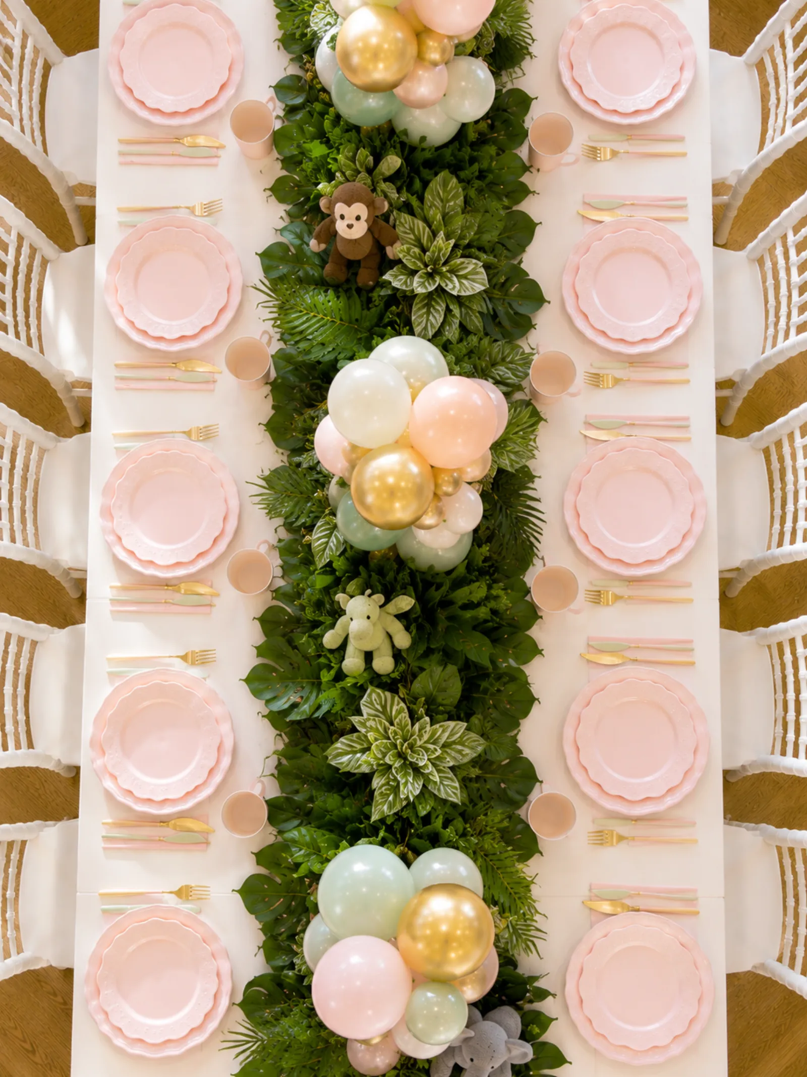 Pastel birthday entrance styling by River Fox Events - soft pastel balloon arch with floral accents at a Surrey venue