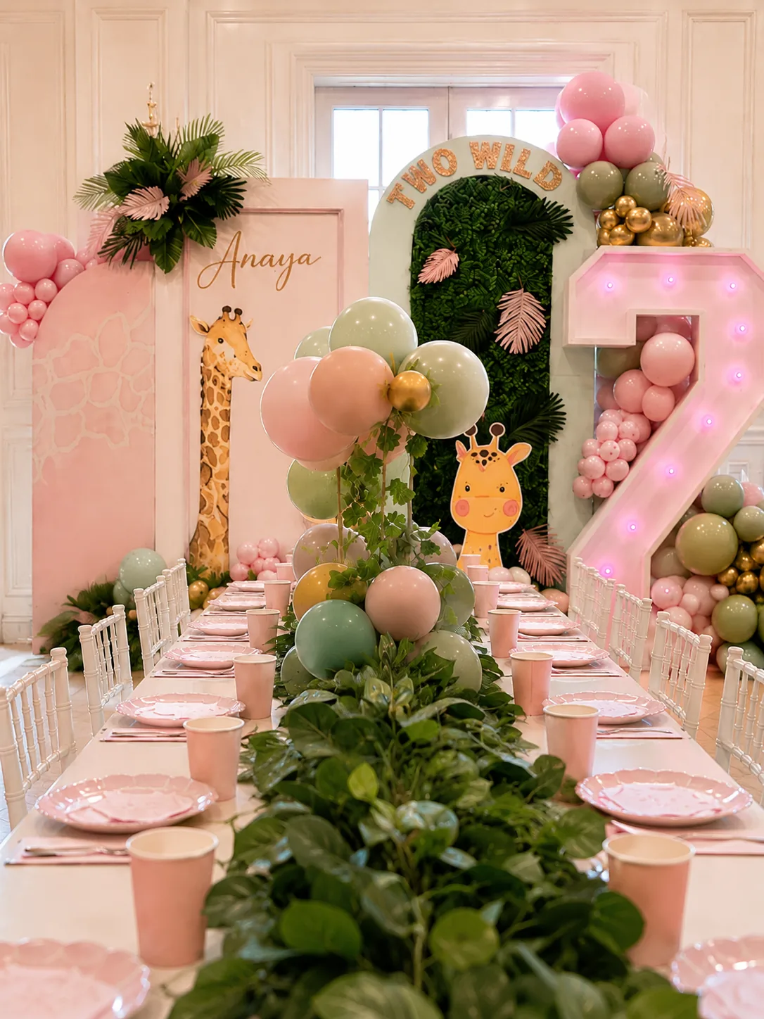Pastel safari Two Wild tablescape for Anaya's second birthday in Surrey by River Fox Events - pink place settings, foliage runner